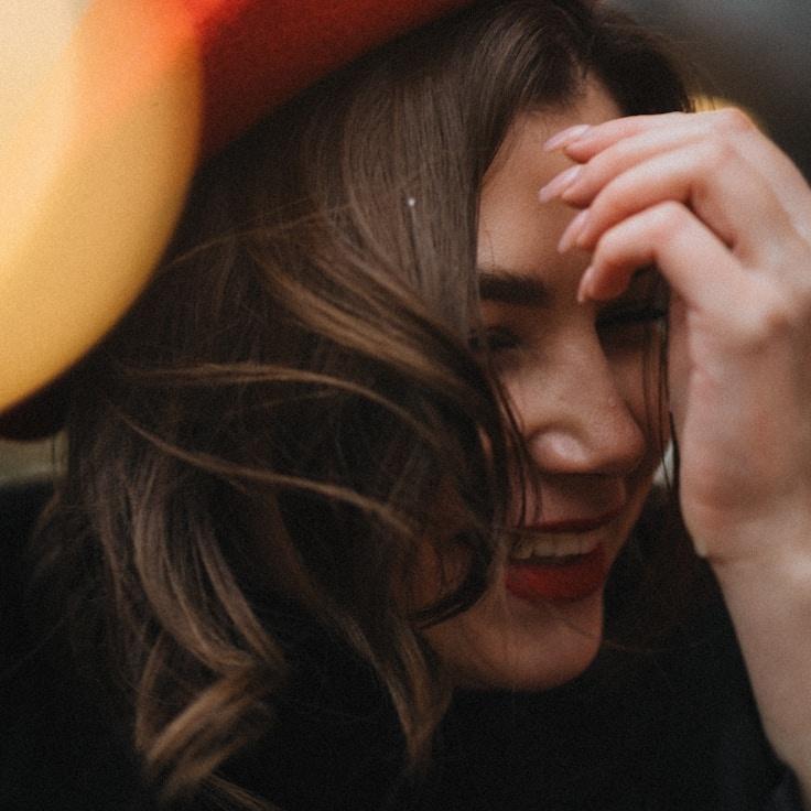 Kaveri Mehta, Lead Design Curator at OakTrailGentle, reviewing corporate floral arrangements